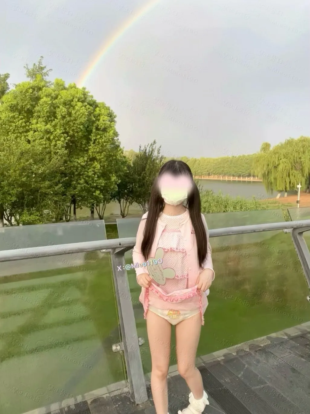An ABDL girl lifting her skirt outdoors to show off her diaper