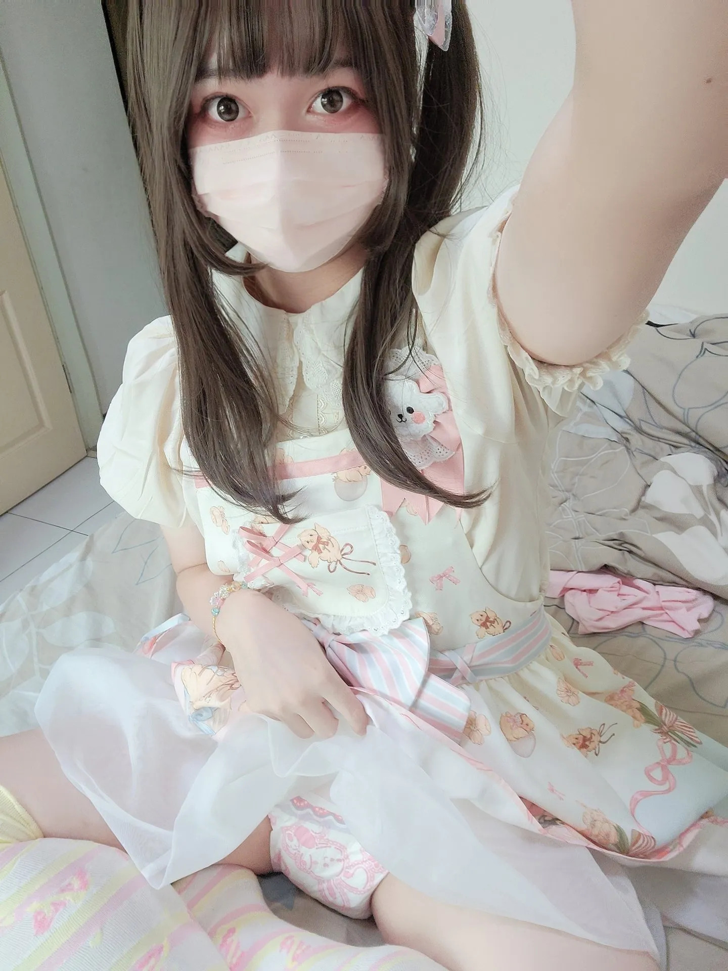 An ABDL girl proudly lifting her skirt to show off her pink diaper