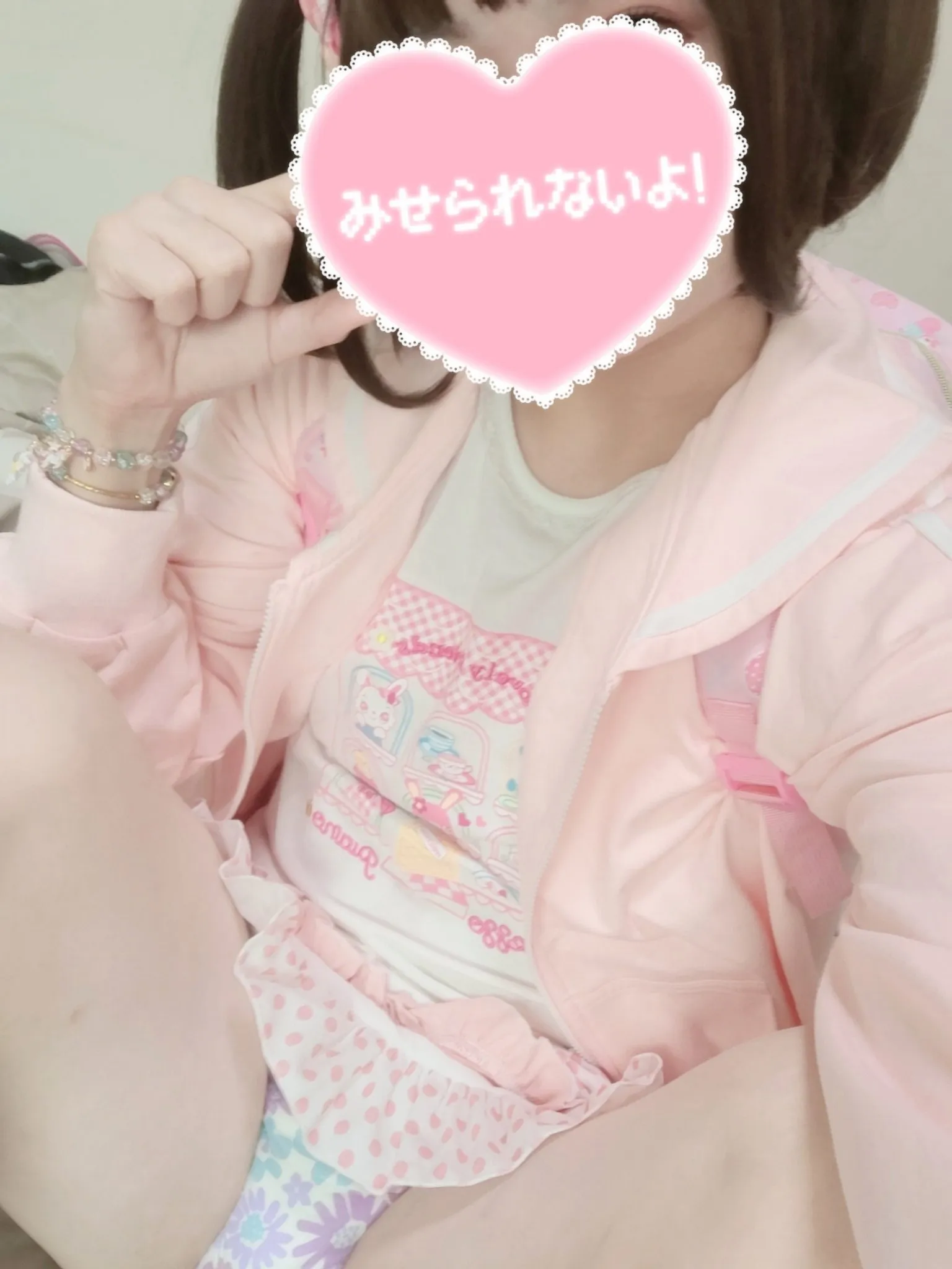 An ABDL girl wearing pink babyish clothes and showing off her diaper