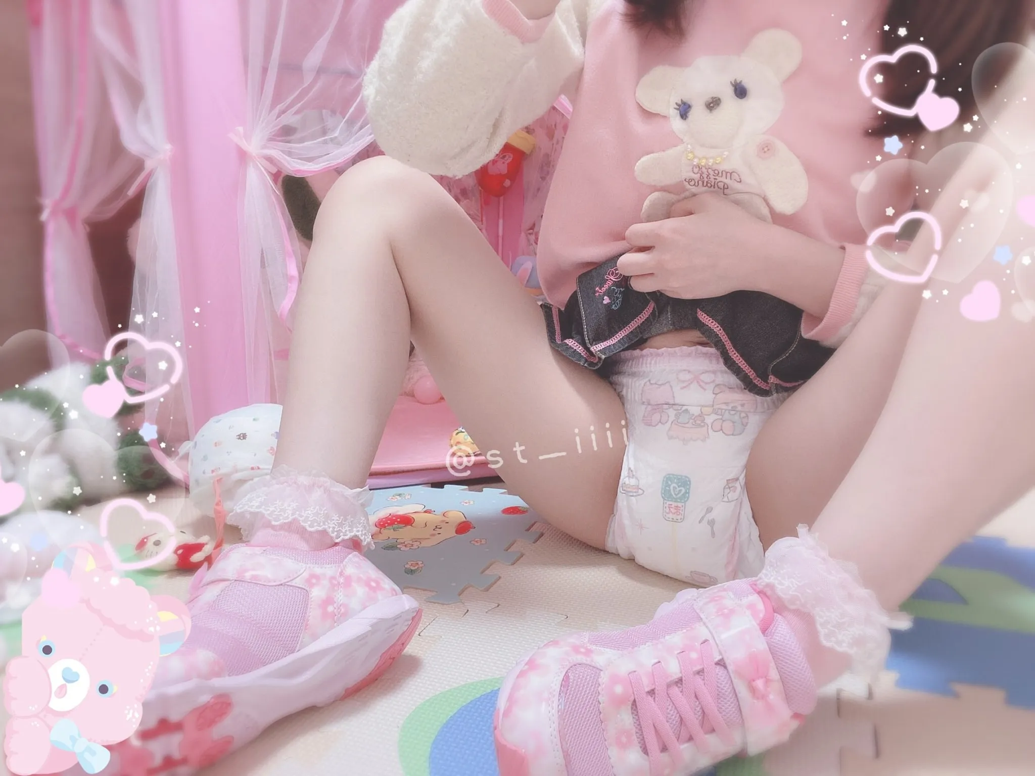The ABDL girl spreads her legs wide to show off her diaper. Her thighs are smooth.