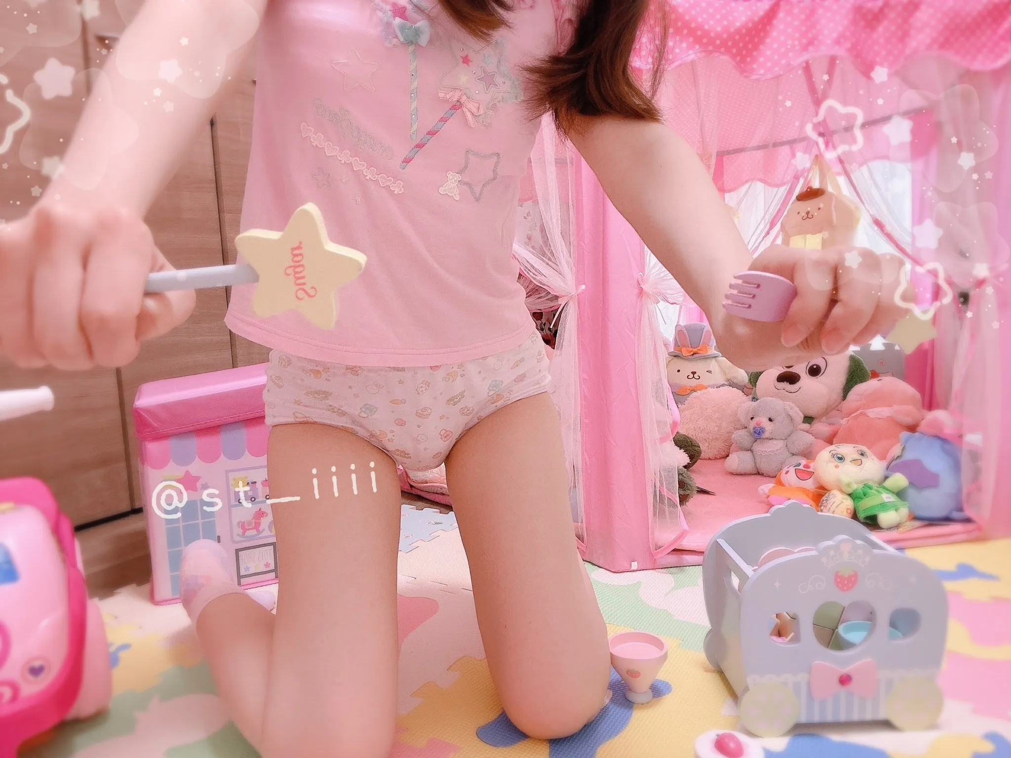 A thick diaper is visible beneath the ABDL girl's skirt.