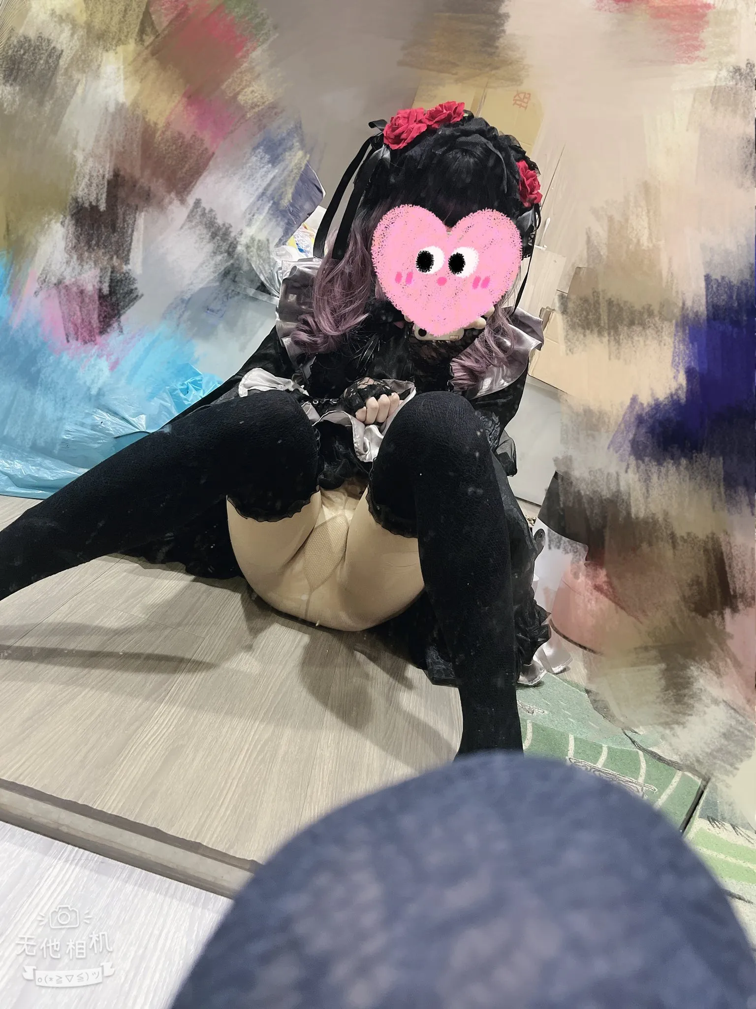 The ABDL girl spreads her legs and shows off her black stockings and diaper.