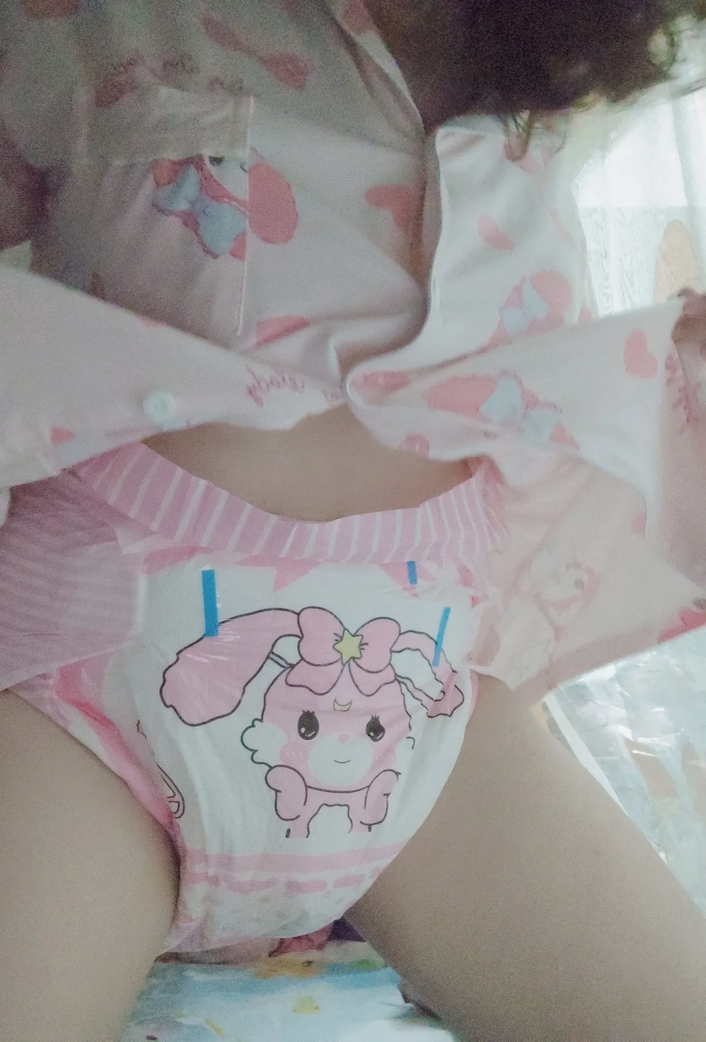 An ABDL girl shows off in her pajamas and bunny hops diapers.