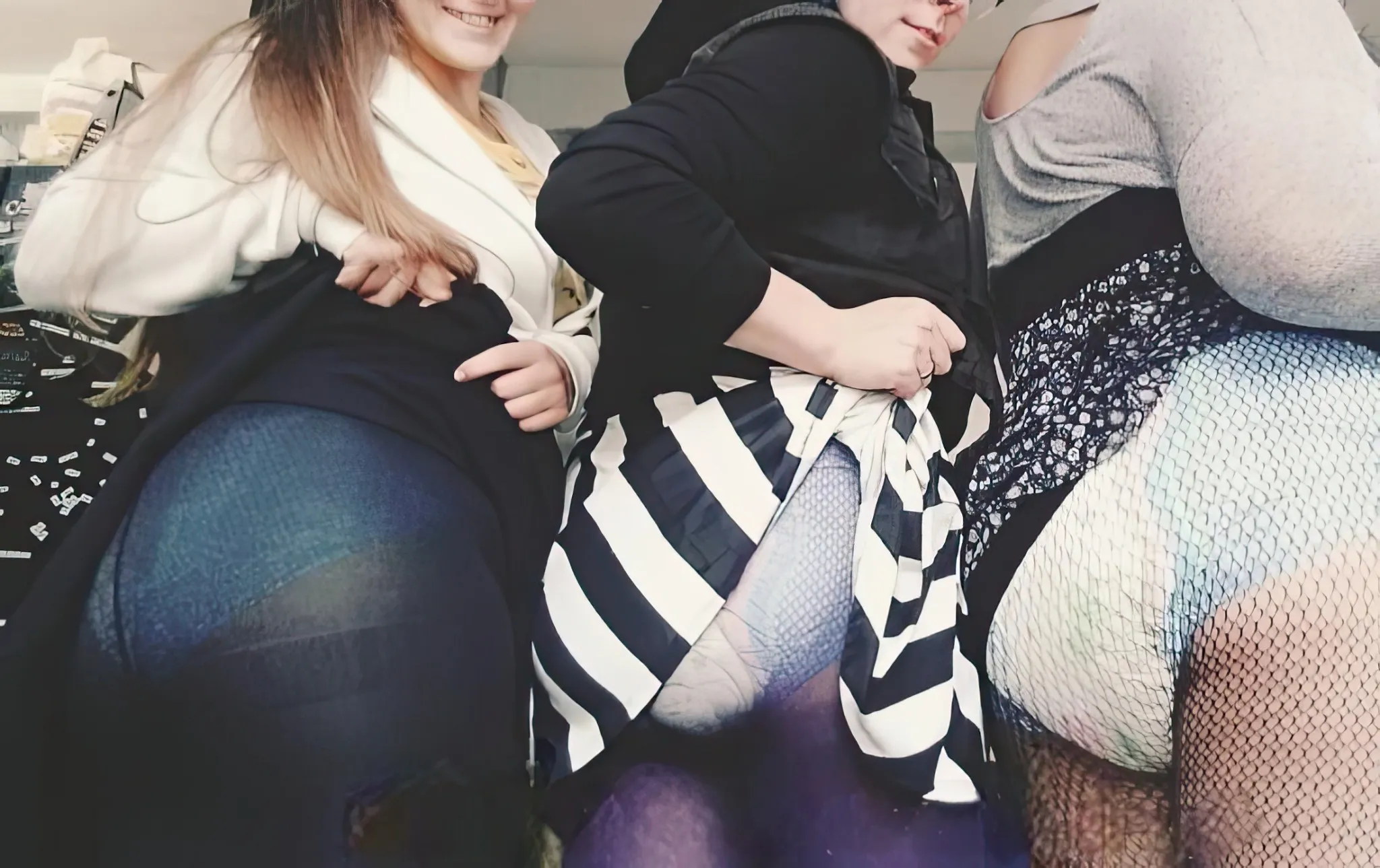 ABDL girls are lifting their skirts to expose their diapers.