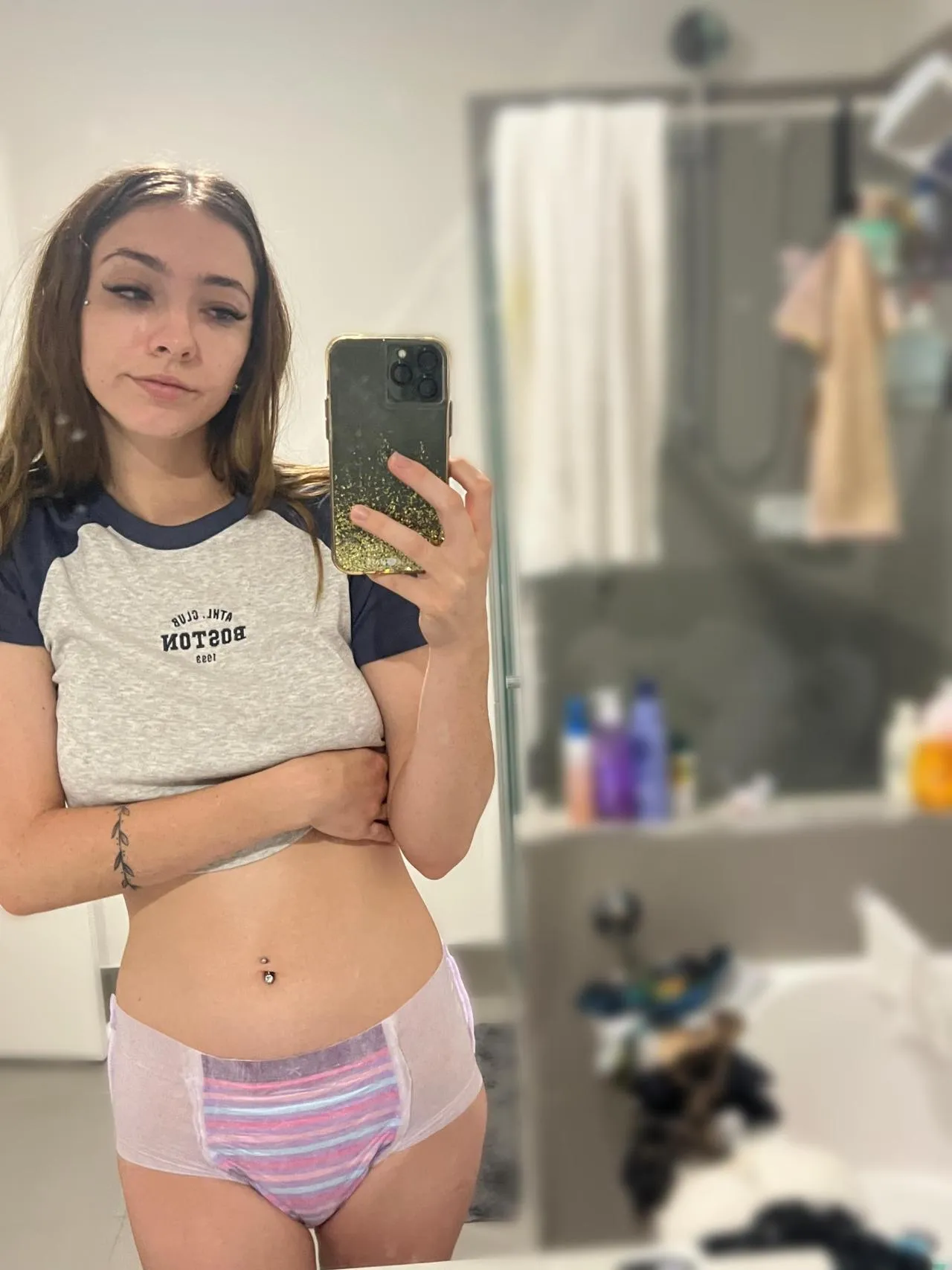 An ABDL girl took a selfie wearing pull-up diapers.