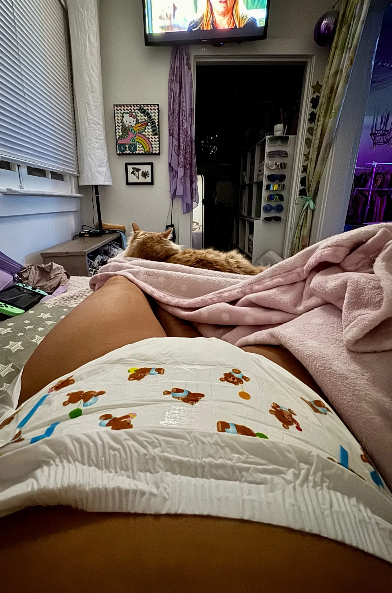 An ABDL girl took a selfie of herself lying down from a first-person perspective.