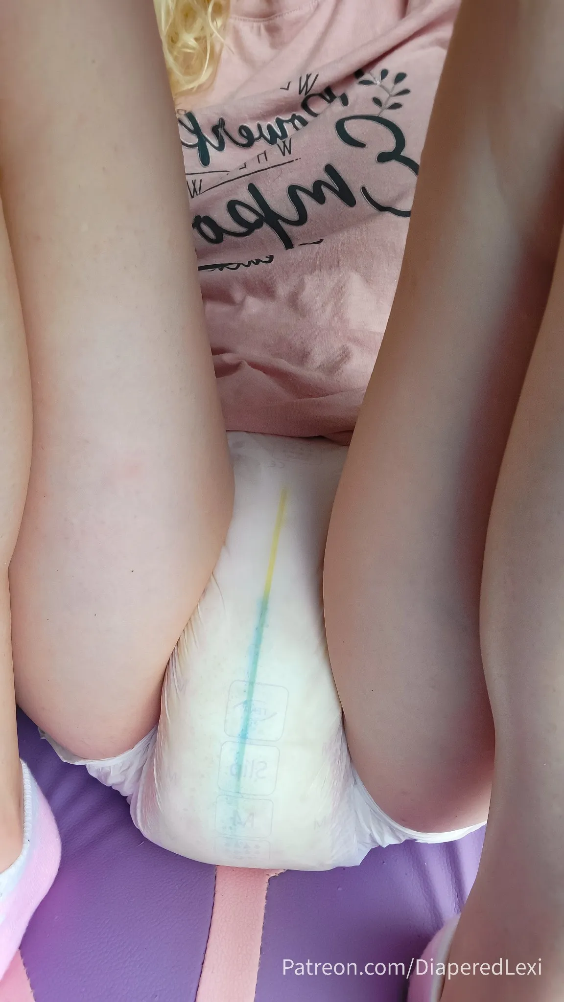 The ABDL girl soaked her diaper with pee.