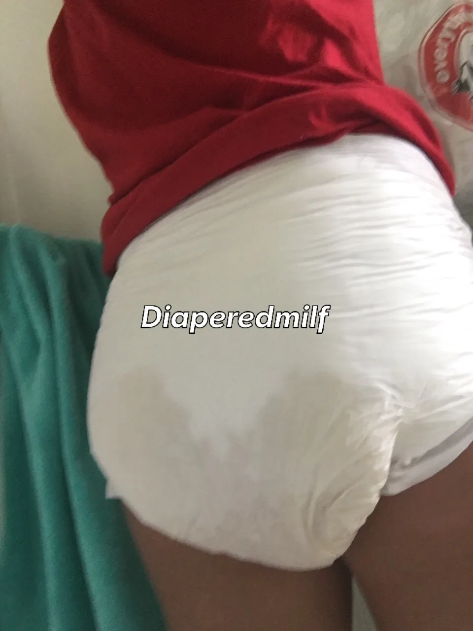 The back view of an ABDL girl's thoroughly soaked diaper