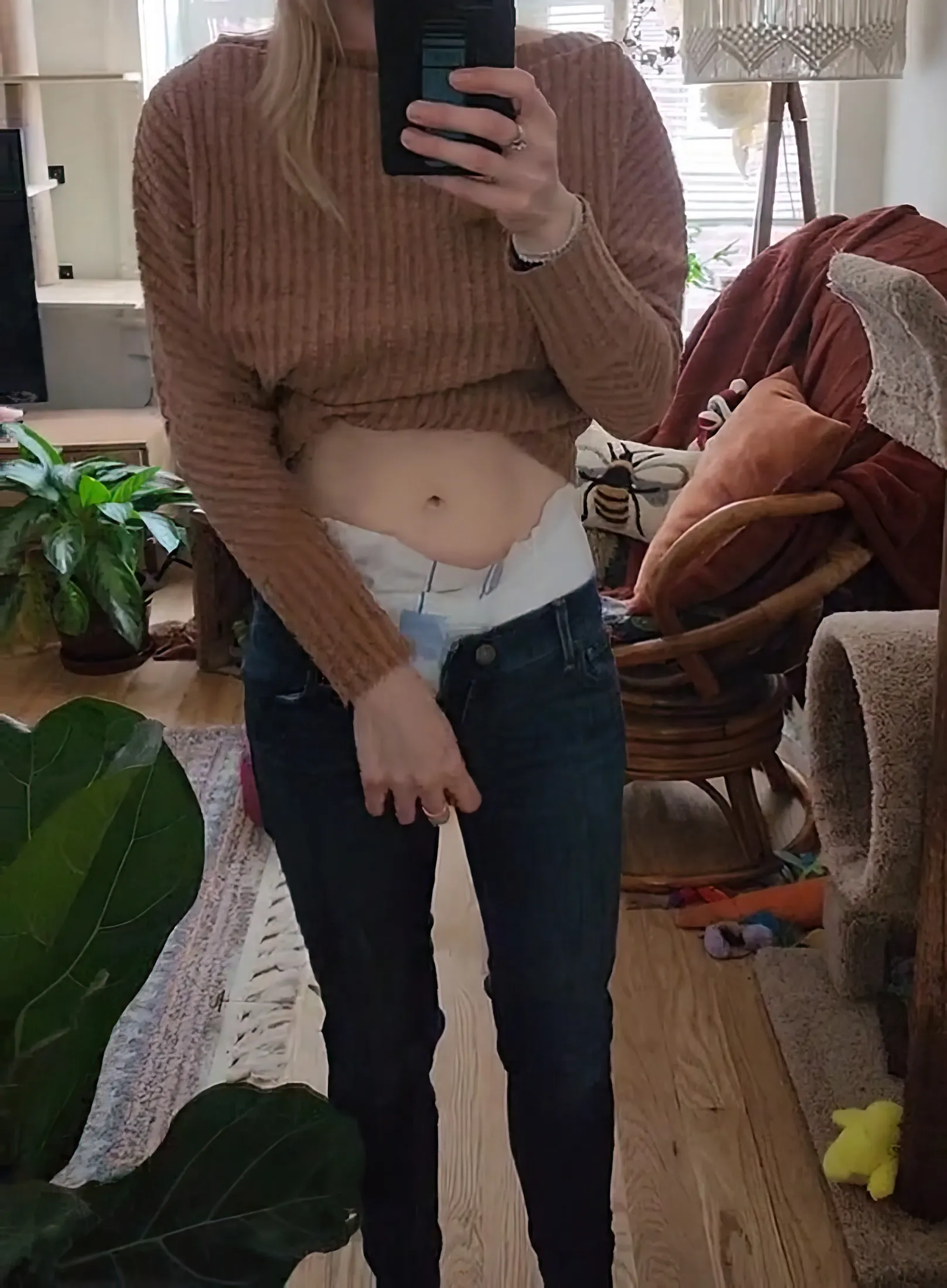 As the ABDL girl slightly pulled down her jeans, adult diapers were exposed.