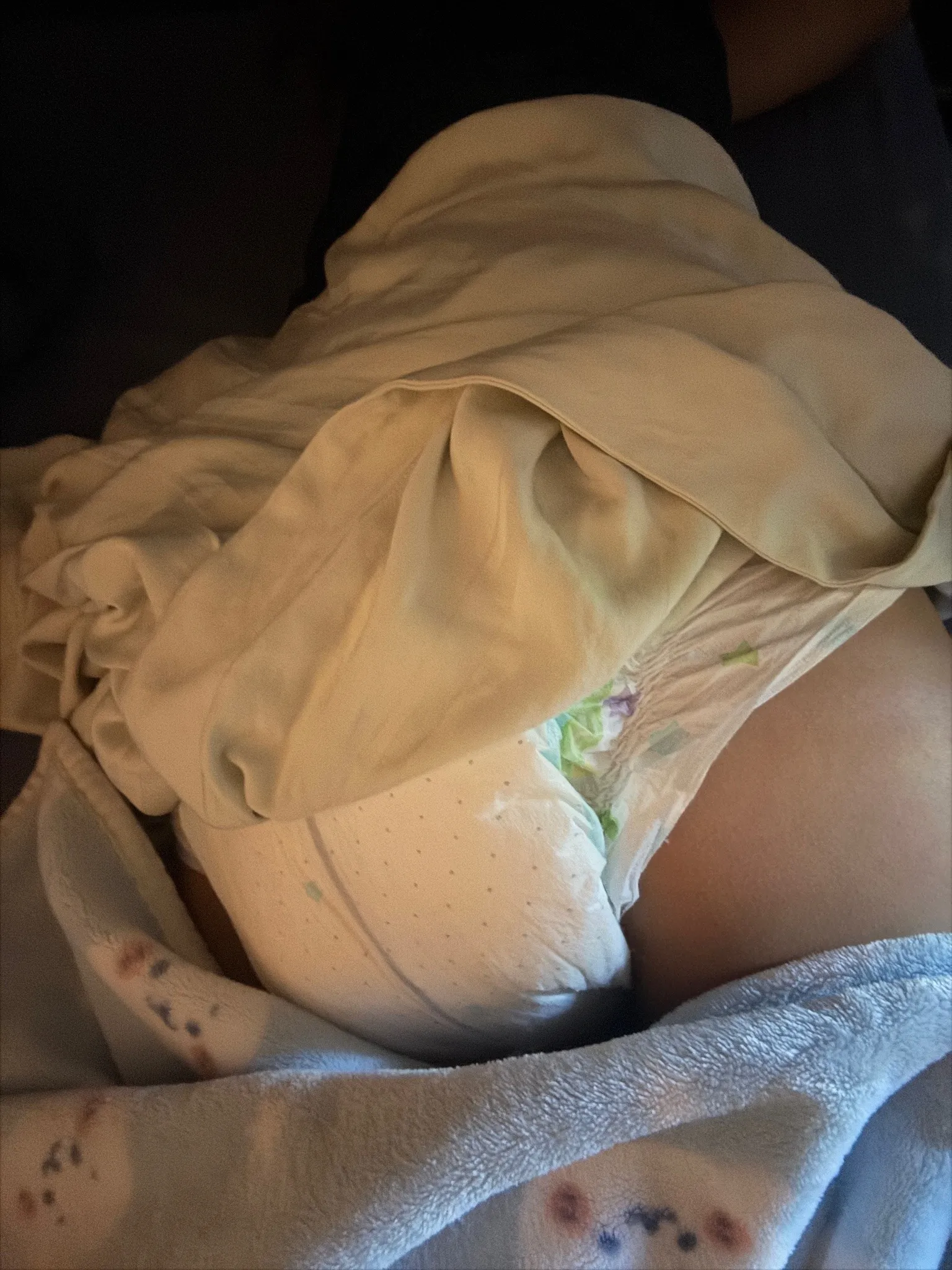 The skirt of the ABDL girl rode up, exposing her thick diaper.