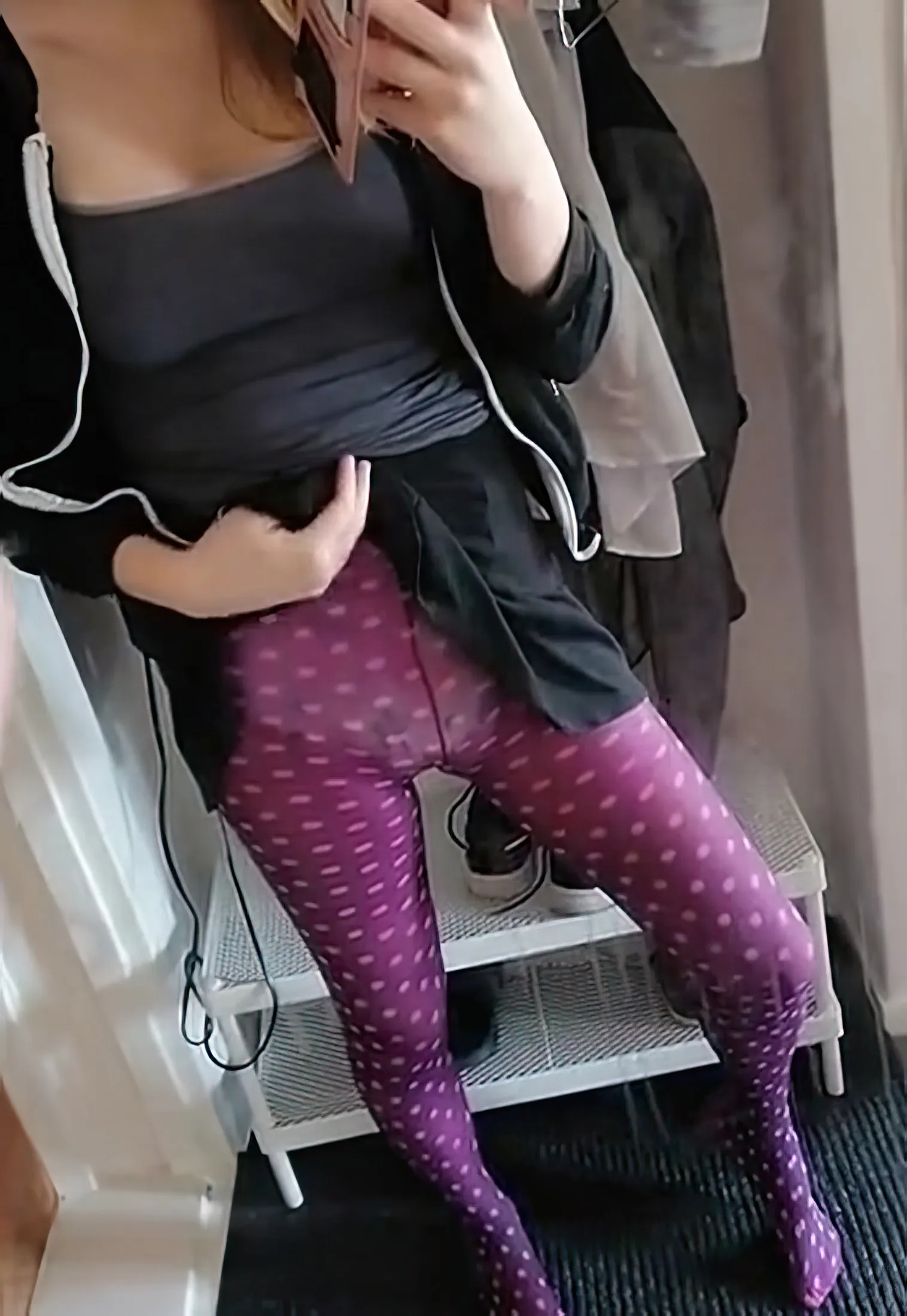 The diaper is visible inside the purple stockings of the ABDL girl.