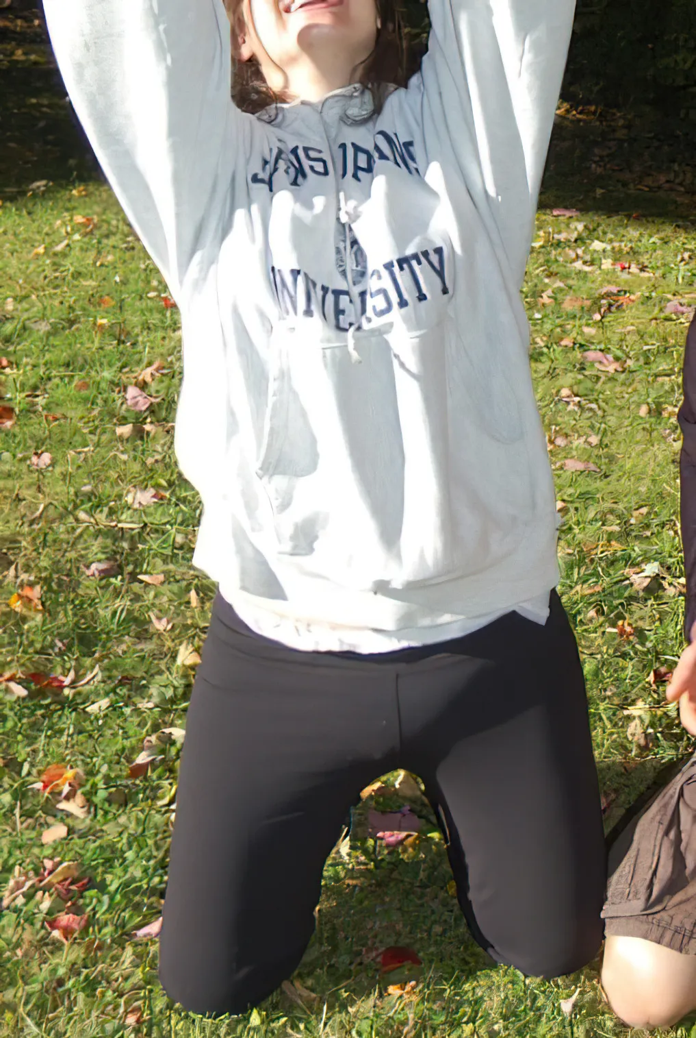 An ABDL girl is outdoors wearing diapers under her leggings.