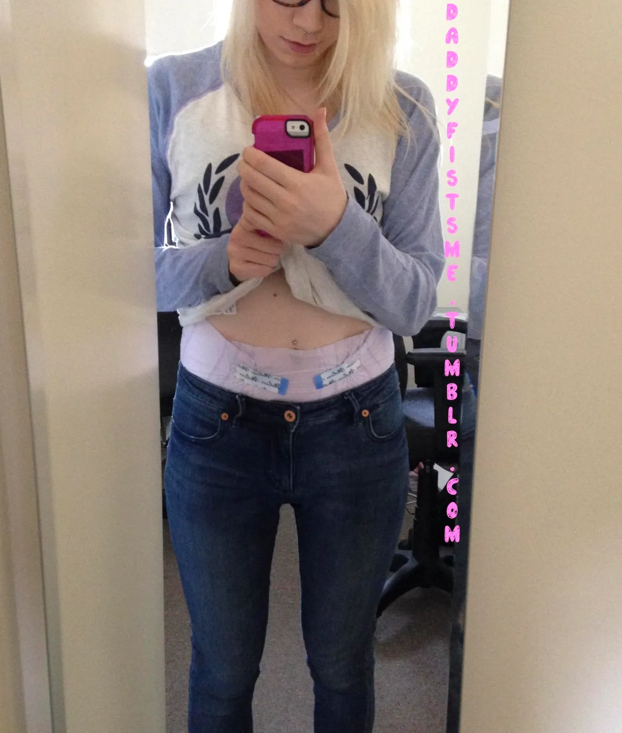 The waistband of the diaper is visible over the ABDL girl's jeans.