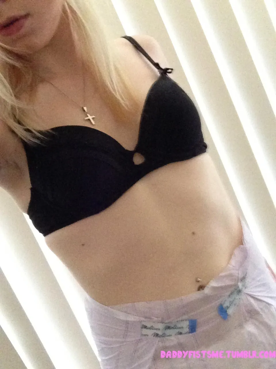 An ABDL girl is wearing a black bra and adult diapers.