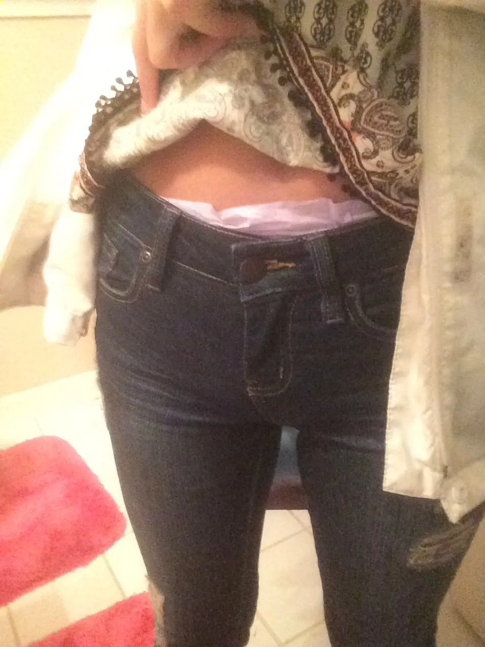 The pink diaper waistband is visible over the ABDL girl's jeans.