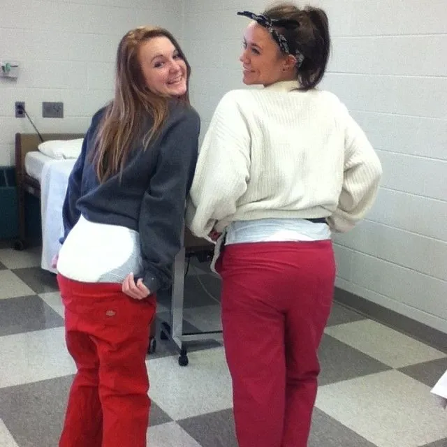 ABDL girls wear red pants and show off their diapers.
