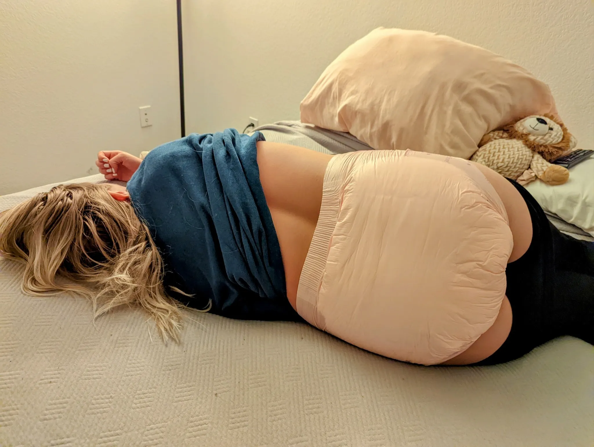 The ABDL girl's pull-up diaper and heart tattoo are visible inside her jeans.