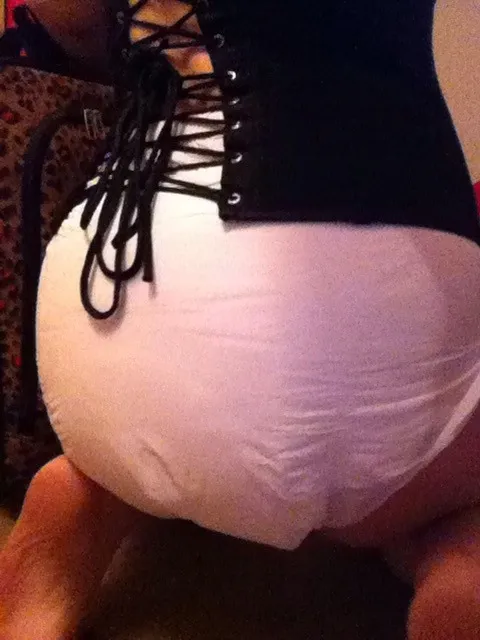 ABDL girl's corset and white diaper.