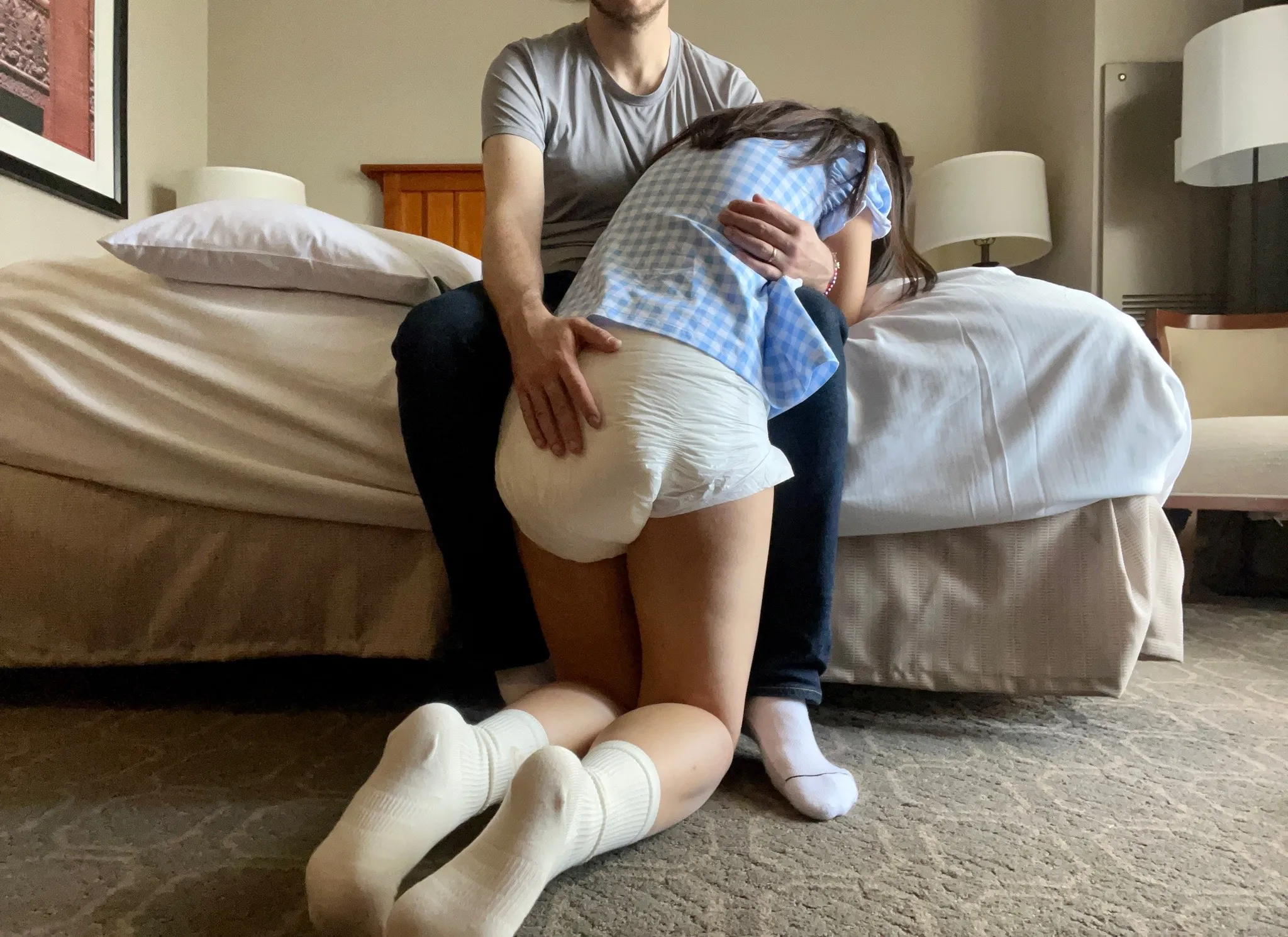 ABDL girl wearing a wet diaper, moments before getting spanked by Daddy.