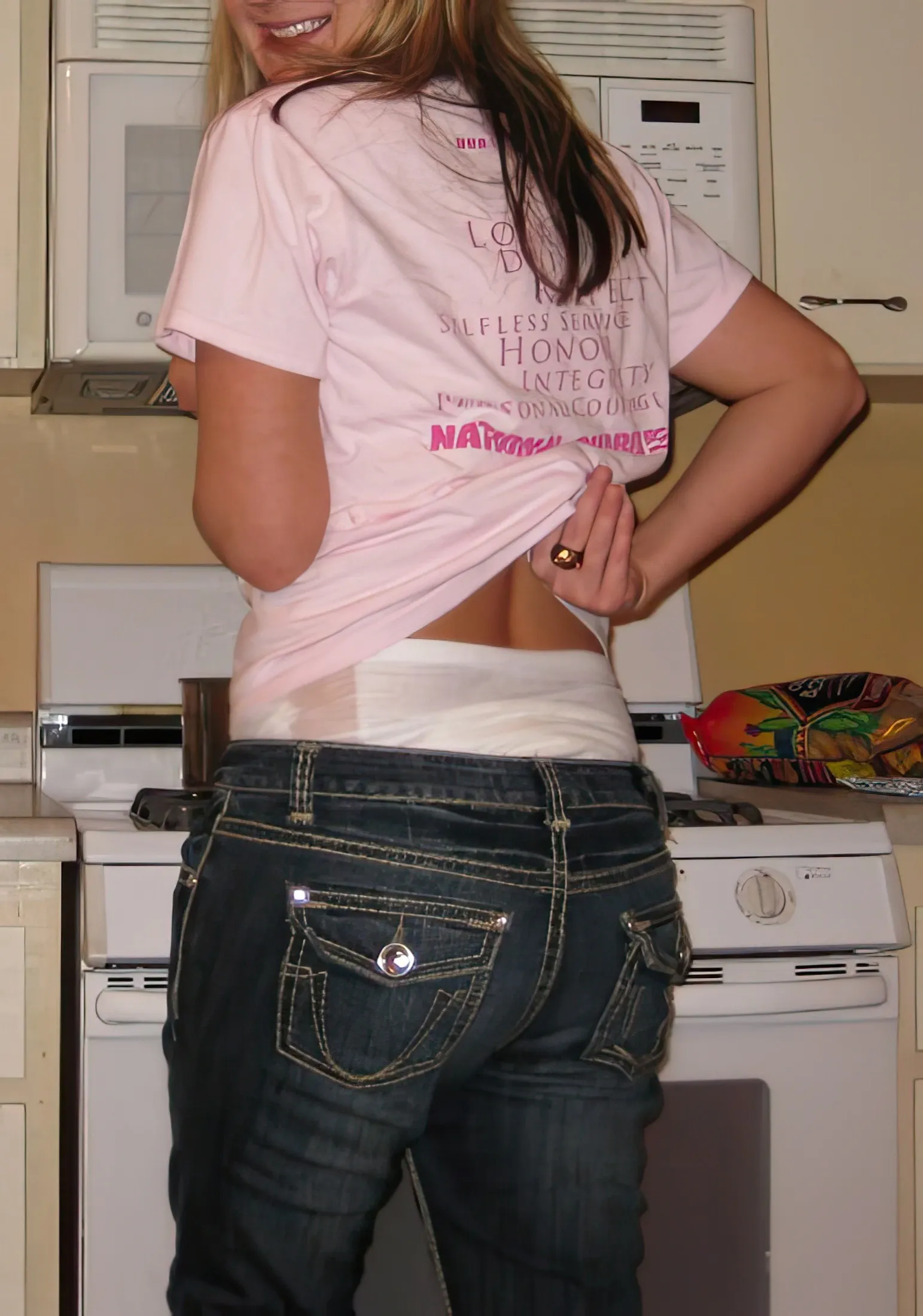 When the ABDL girl lifted her top, the diaper waistband was exposed over her jeans.