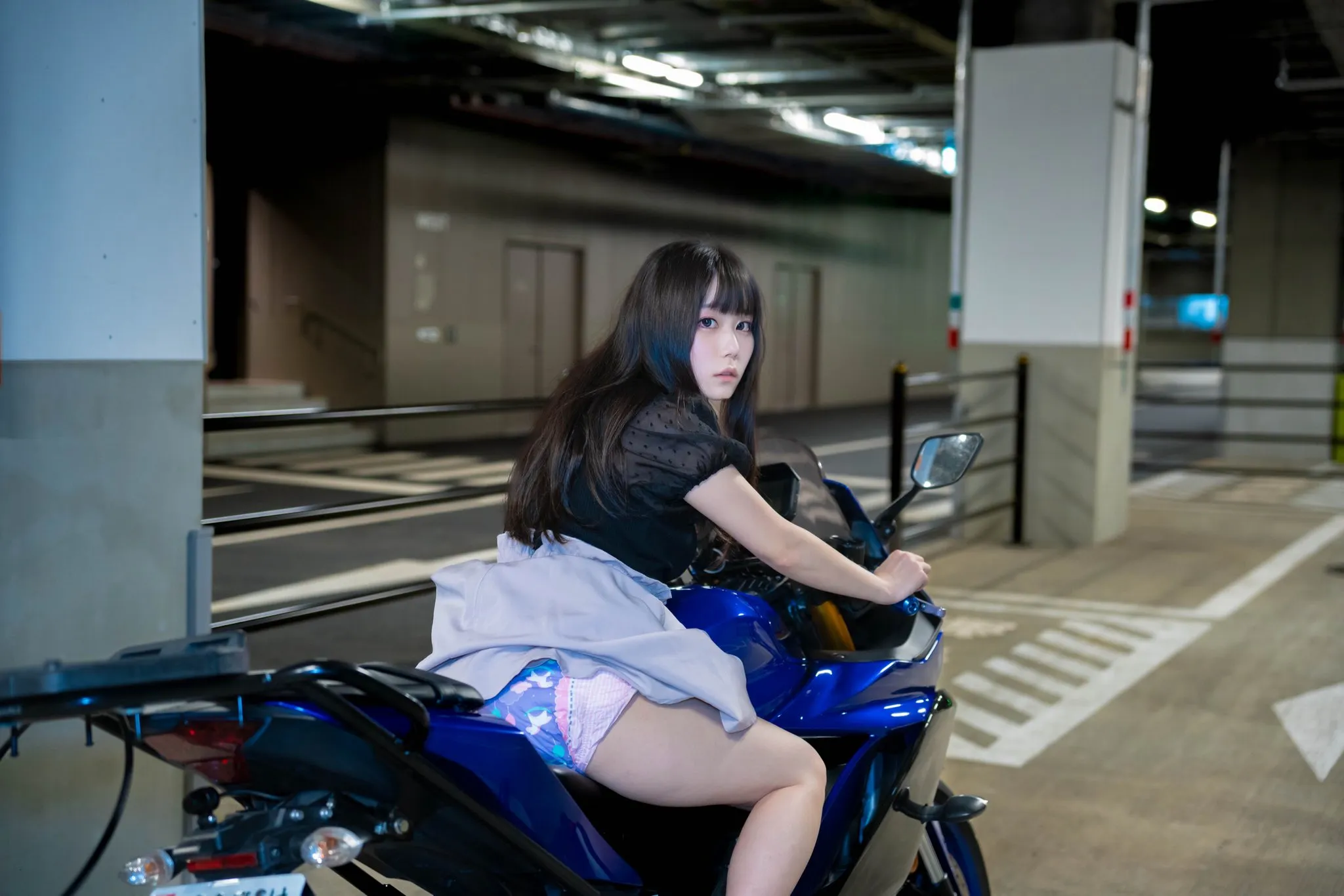 An ABDL girl is riding a motorcycle while wearing a diaper.