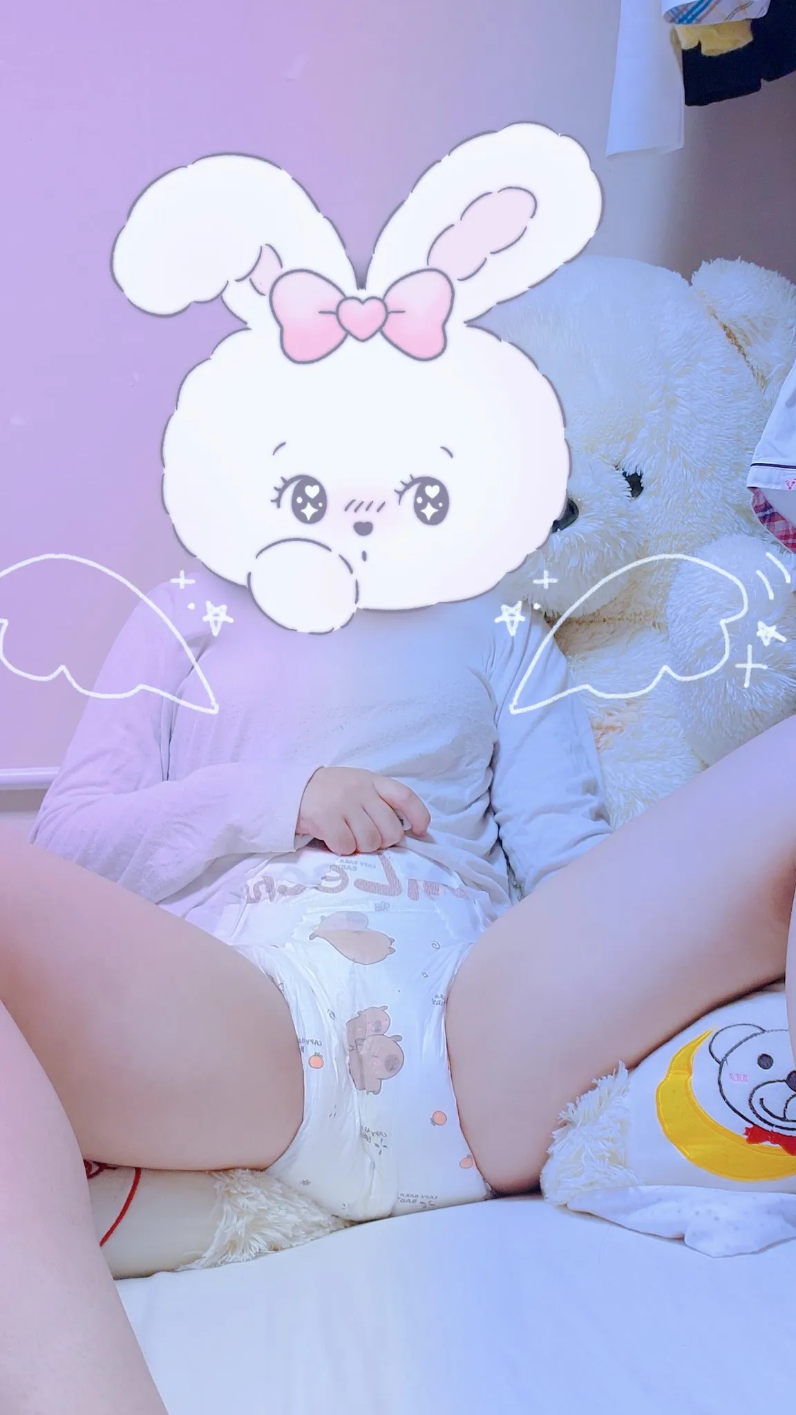 An ABDL girl spreads her legs on the bed and shows off her capybara diaper.