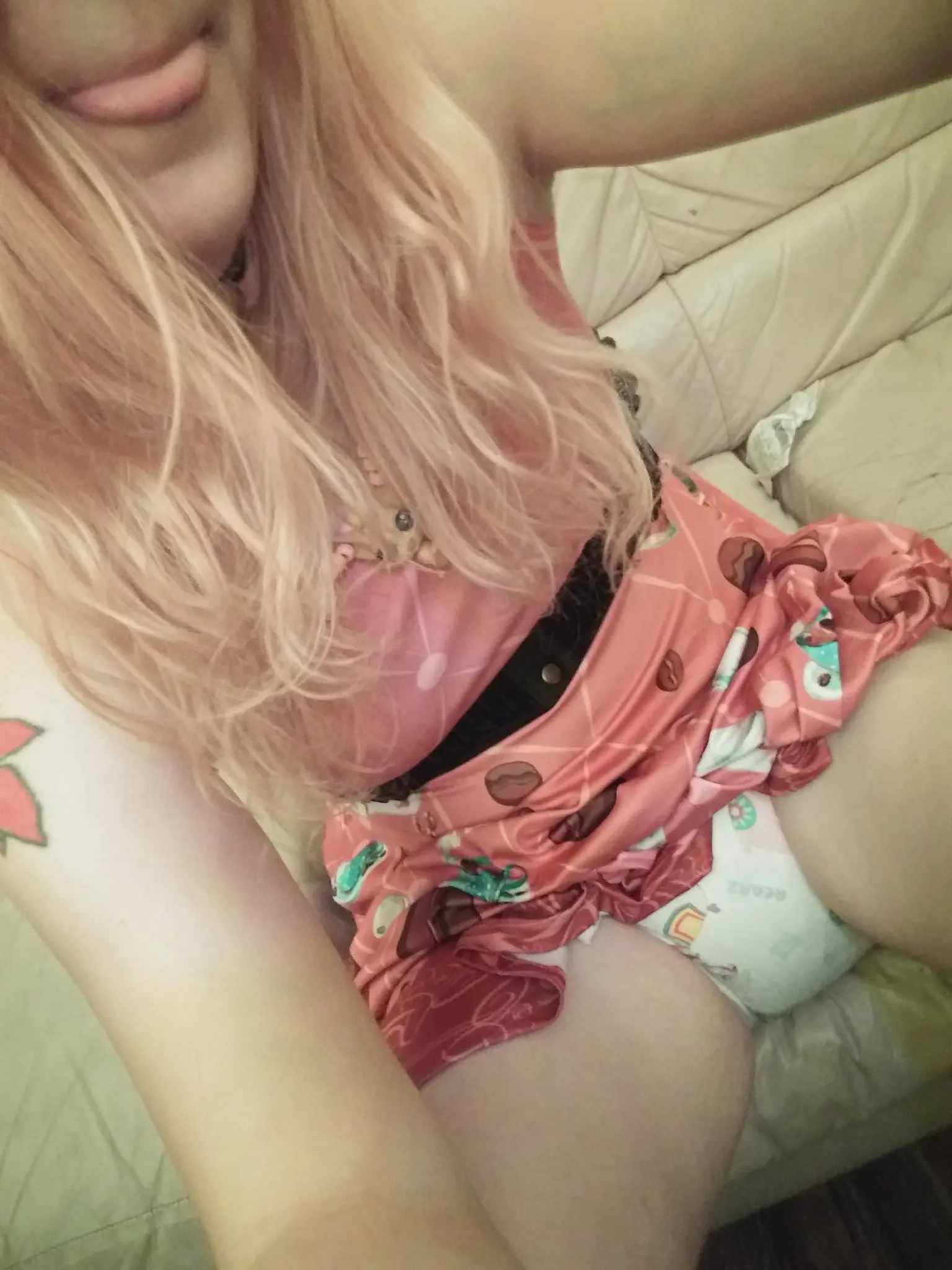 ABDL girl lifts her dress to expose her diaper.