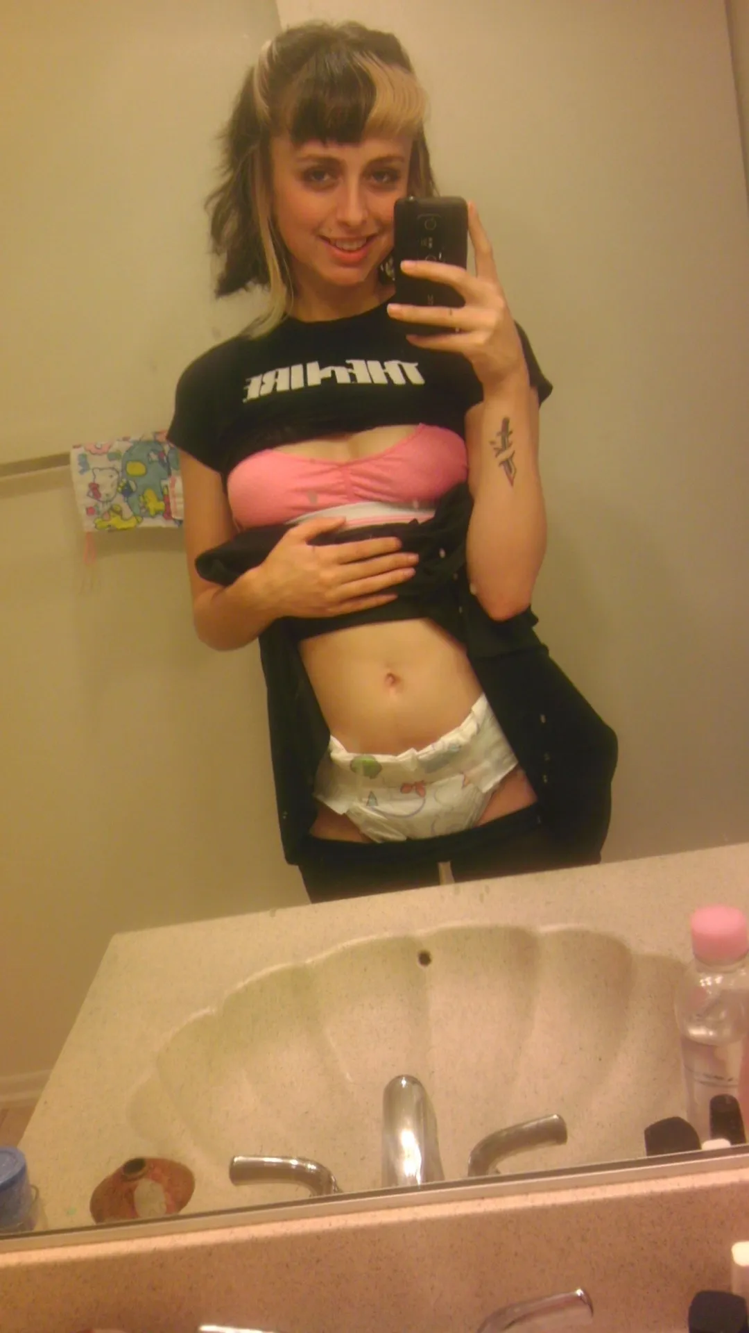 The faintly visible pink bra and diaper perfectly capture your cuteness.