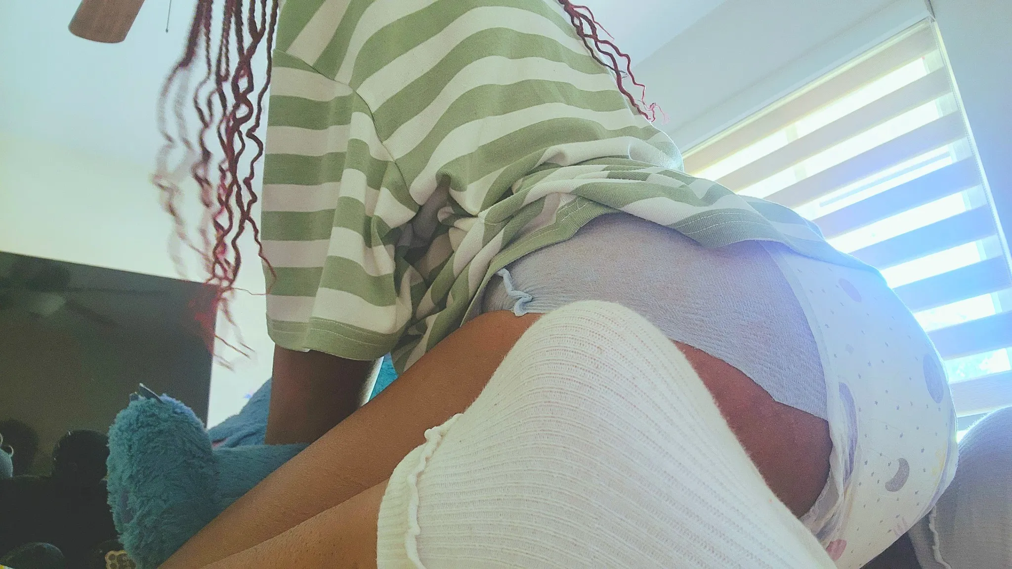 The diaper's getting too tight, so pee's leaking back into my pussy again.